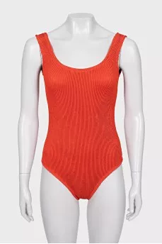 One-piece swimsuit with open back and tag