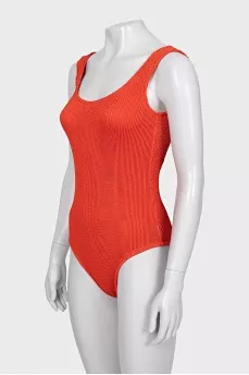 One-piece swimsuit with open back and tag