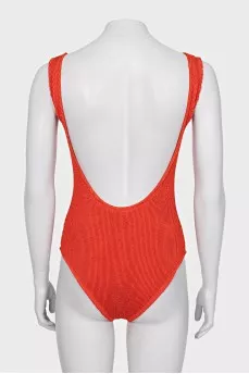 One-piece swimsuit with open back and tag
