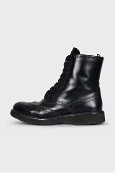 Leather boots with a zipper and perforations