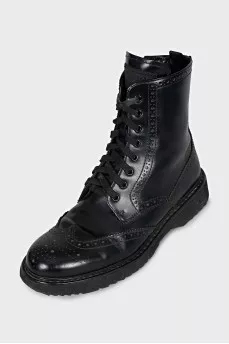Leather boots with a zipper and perforations