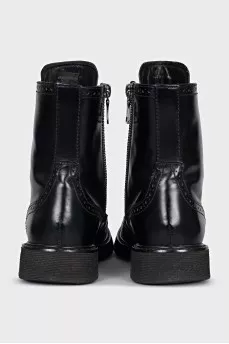 Leather boots with a zipper and perforations