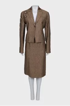 Suit consisting of a jacket with decor and a skirt