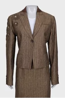Suit consisting of a jacket with decor and a skirt