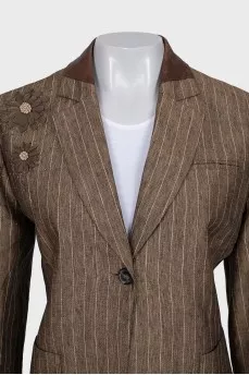 Suit consisting of a jacket with decor and a skirt