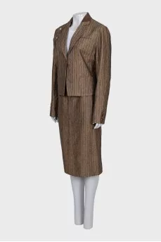 Suit consisting of a jacket with decor and a skirt