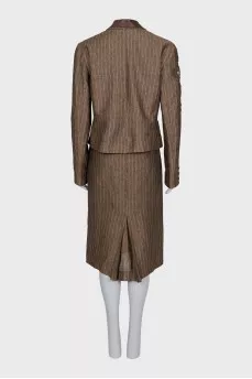 Suit consisting of a jacket with decor and a skirt