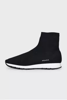 Black textile sneakers with a white sole