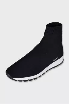 Black textile sneakers with a white sole