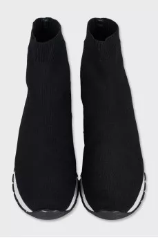 Black textile sneakers with a white sole