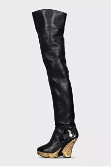 Leather over-the-knee boots with a gold wedge heel