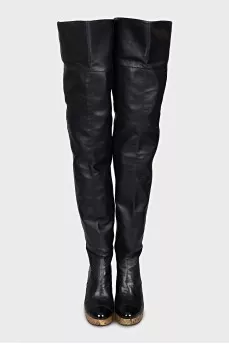 Leather over-the-knee boots with a gold wedge heel