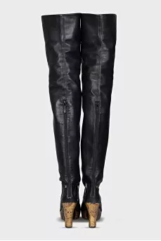 Leather over-the-knee boots with a gold wedge heel