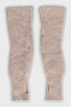 Knitted gloves with a finger hole