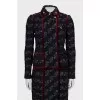 A suit consisting of a jacket and skirt with velvet trim