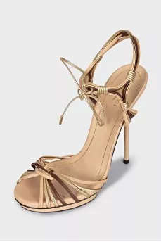Gold leather lace-up sandals