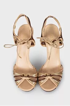 Gold leather lace-up sandals