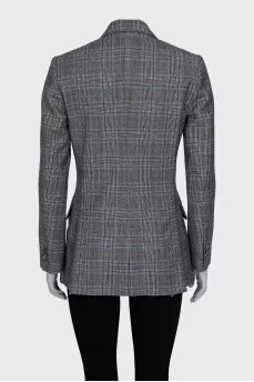 A straight-cut checkered jacket with a button