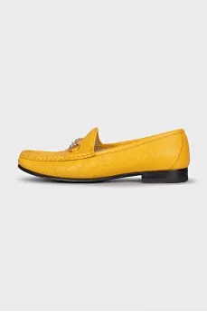 Yellow loafers with gold decor