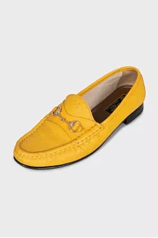 Yellow loafers with gold decor