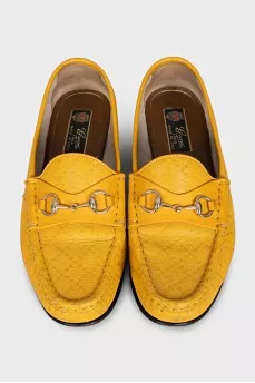 Yellow loafers with gold decor