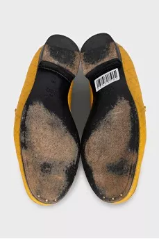 Yellow loafers with gold decor