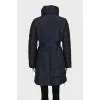 Blue coat with a high collar