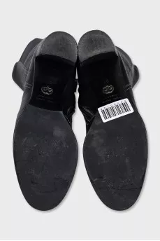 Black boots with textile inserts