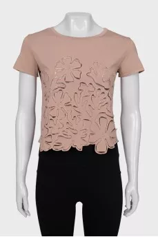Cropped T-shirt decorated with perforations