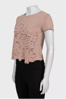 Cropped T-shirt decorated with perforations
