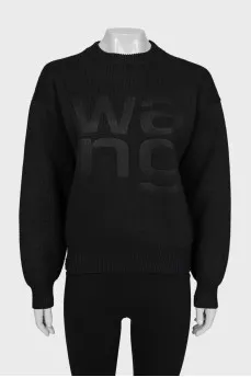 Knitted sweater with embossed logo