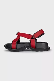 Red sandals made of fabric and leather