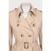 Fitted coat with buttoned pockets