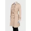 Fitted coat with buttoned pockets