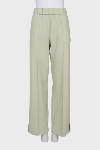 Wide trousers with slits at the bottom
