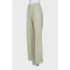 Wide trousers with slits at the bottom