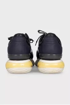 Leather and textile sneakers with a high sole