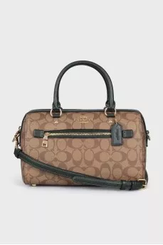 A bag with handles and a strap in a signature print