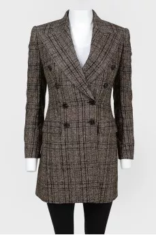 Double -breasted jacket in a cage with a tag
