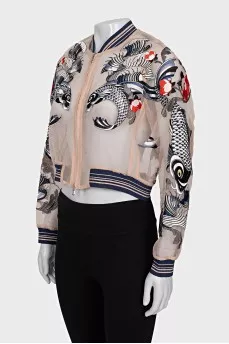 Transparent bomber jacket decorated with embroidery
