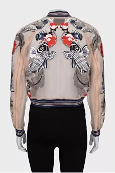 Transparent bomber jacket decorated with embroidery
