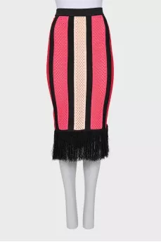 An openwork suit consisting of a top and a fringed skirt