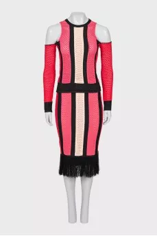 An openwork suit consisting of a top and a fringed skirt