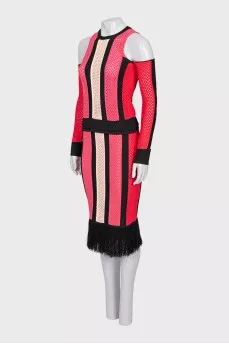 An openwork suit consisting of a top and a fringed skirt