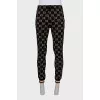 Men's sweatpants with a signature print