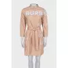 Dress with a buttoned patch pocket