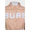 Dress with a buttoned patch pocket