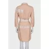 Dress with a buttoned patch pocket