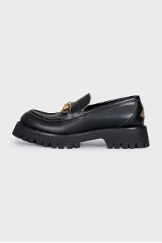 Black leather loafers with gold embroidery
