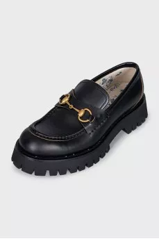 Black leather loafers with gold embroidery